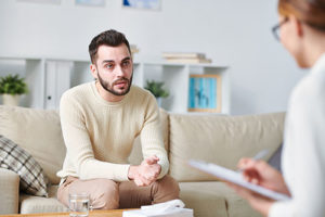 man talking to therapist